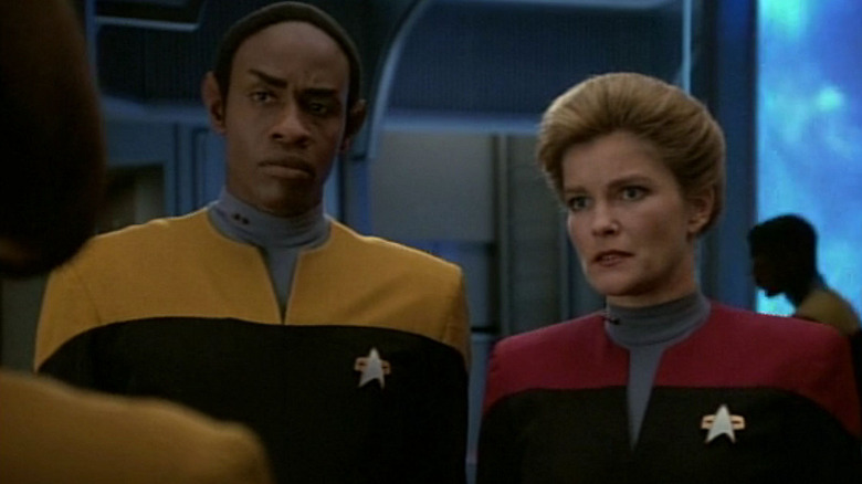 Captain Janeway and Tuvok talking with another crewmember on Star Trek: Voyager